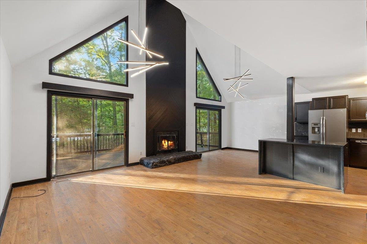 5433 Penrith Drive Durham, NC 27713 - Photo 5 of 47 a view of an empty room with a fireplace and a window