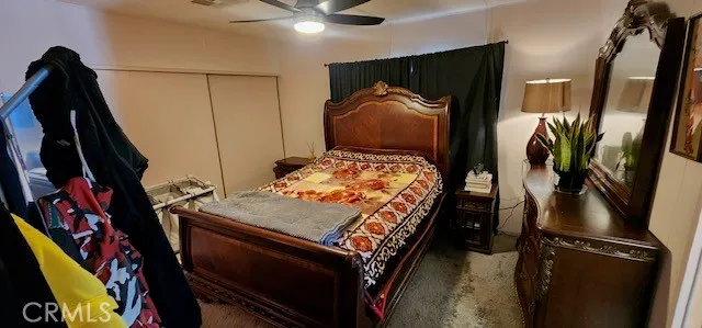 a view of a swimming pool with a yard and plants