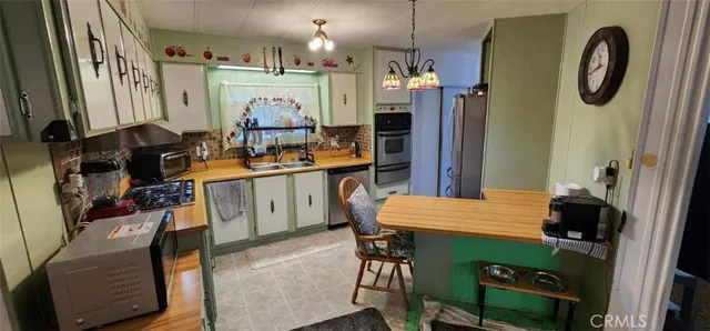 a view of two chairs in a patio