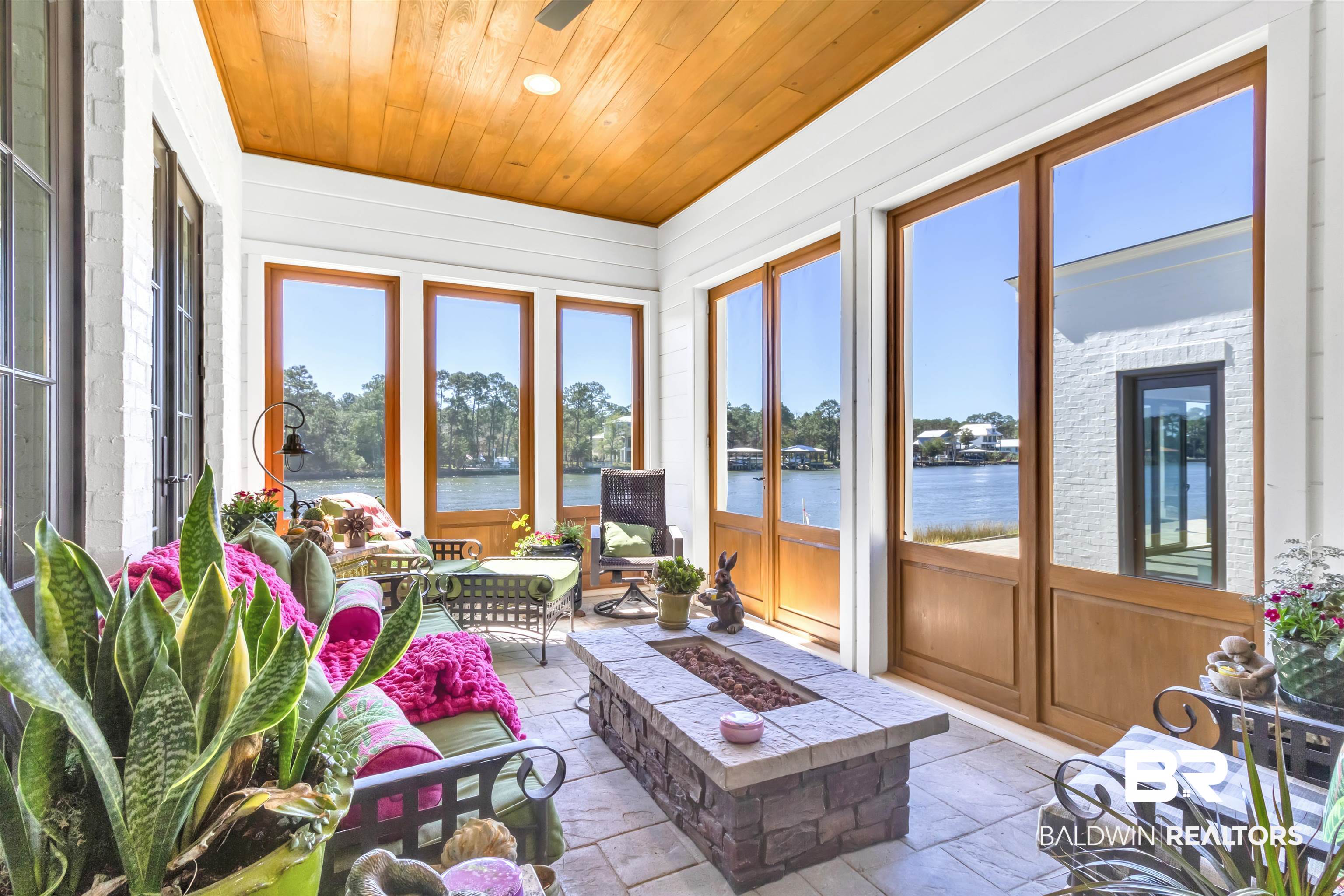 885 Inlet Circle Gulf Shores, AL 36542 - Photo 31 of 36 Sunroom / solarium with a water view and wooden ceiling