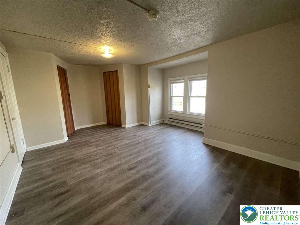 917 Center Street Bethlehem, PA 18018 - Photo 11 of 11 an empty room with wooden floor and windows