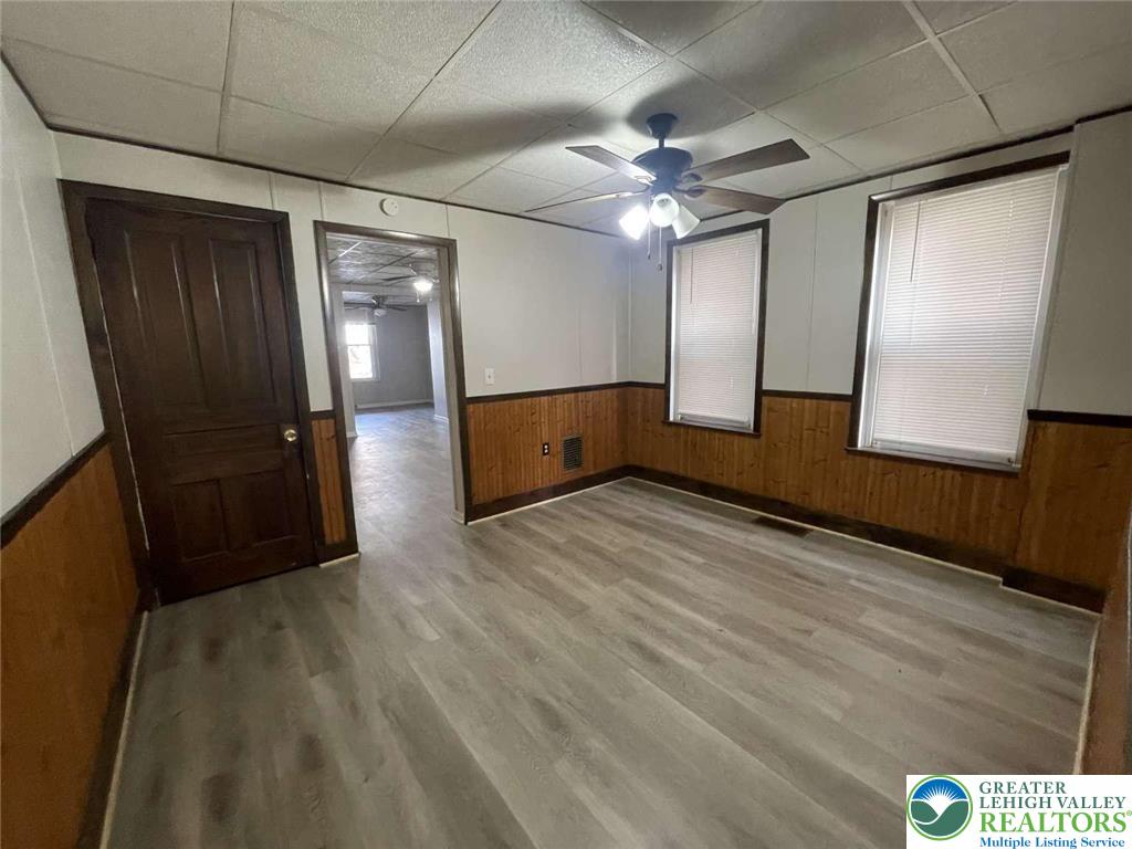 917 Center Street Bethlehem, PA 18018 - Photo 6 of 11 a view of an empty room with wooden floor and a window