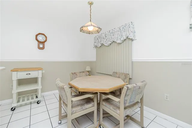 a bed room with a bed and a chair