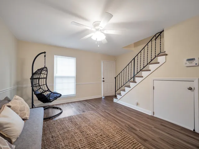 a view of an entryway with wooden floor