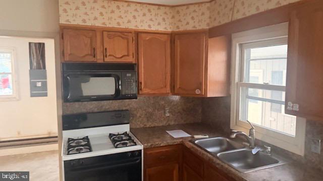 Cozy kitchen with classic wooden cabinetry.