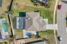 a utility room with stainless steel appliances wooden floor and chandelier
