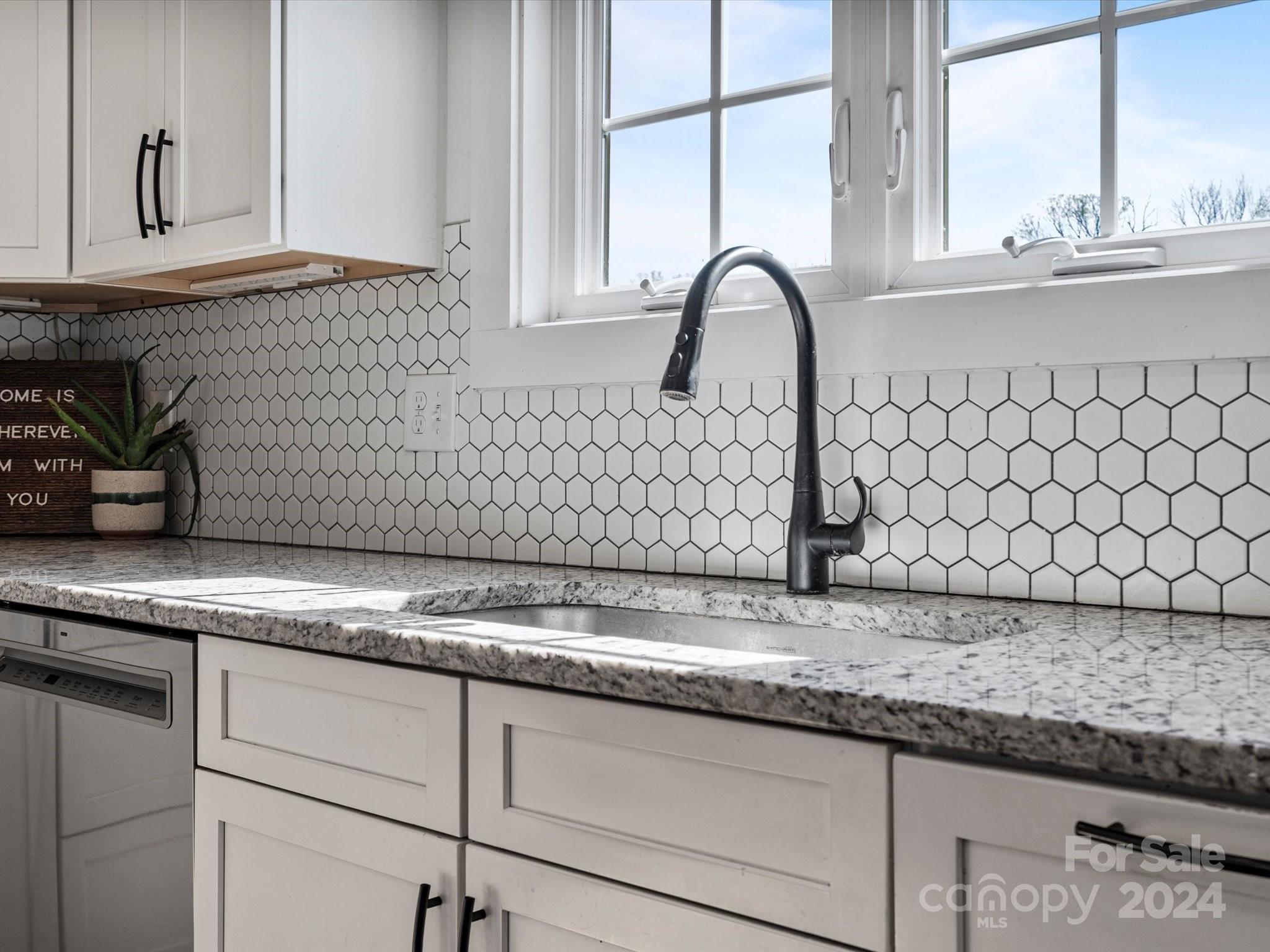 4078 Booney Road Rock Hill, SC 29730 - Photo 13 of 41 a kitchen with granite countertop a sink and a window