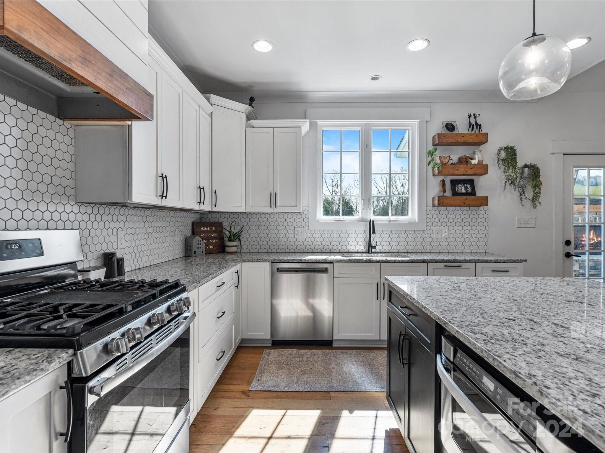 4078 Booney Road Rock Hill, SC 29730 - Photo 14 of 41 a kitchen with a stove sink and cabinets