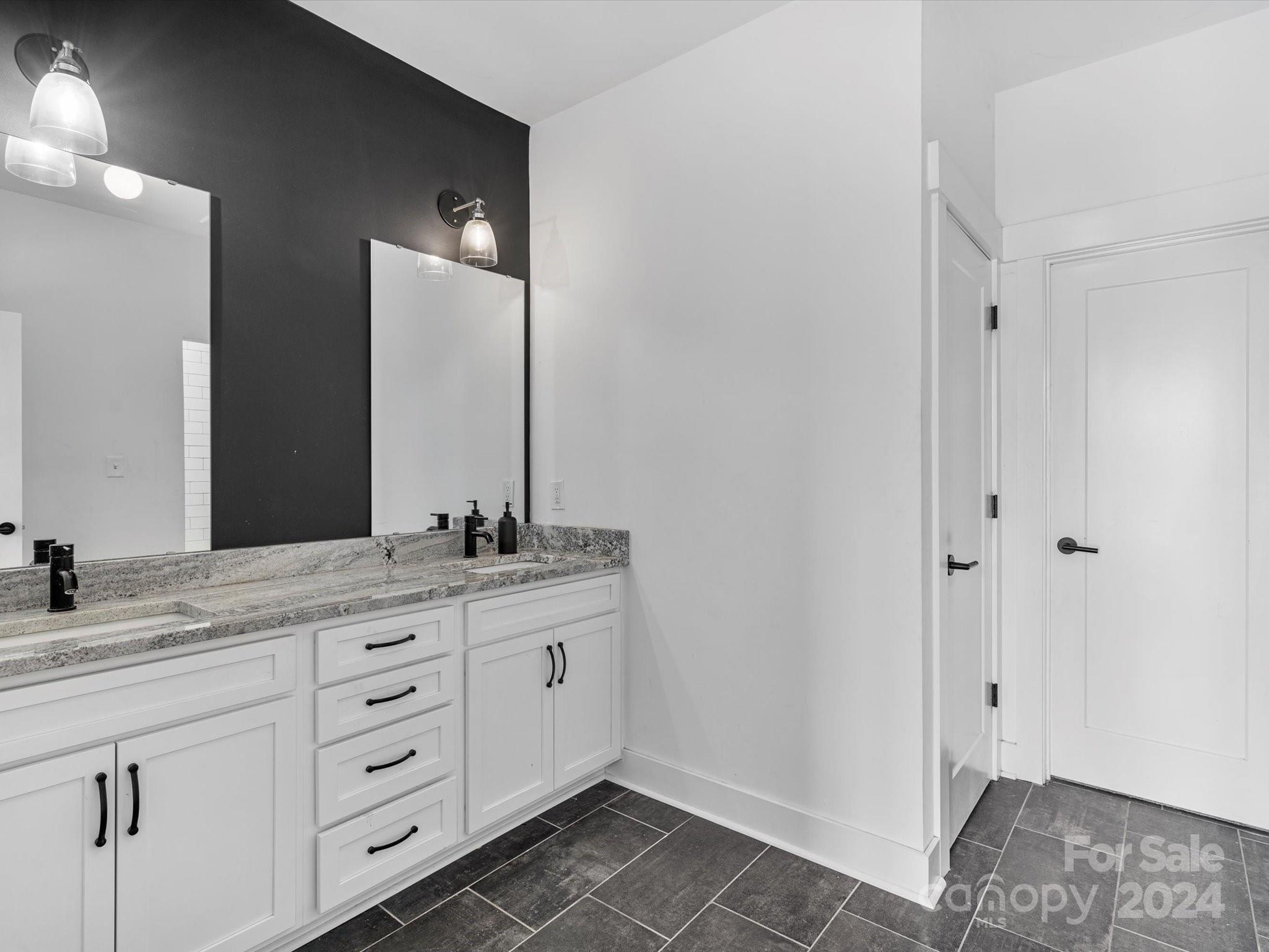 4078 Booney Road Rock Hill, SC 29730 - Photo 24 of 41 a bathroom with a sink and a mirror