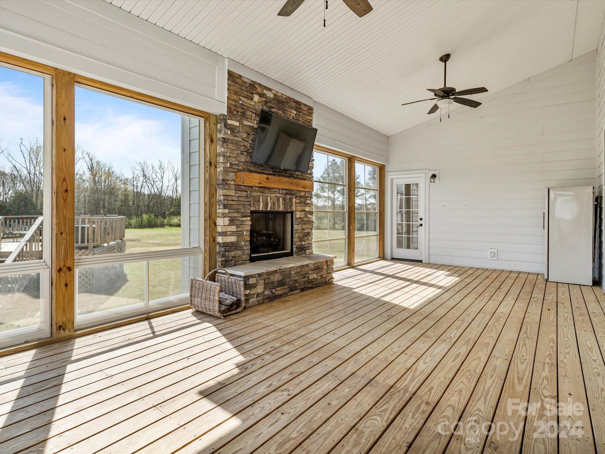 4078 Booney Road Rock Hill, SC 29730 - Photo 29 of 41 a view of a livingroom with wooden floor and a fireplace