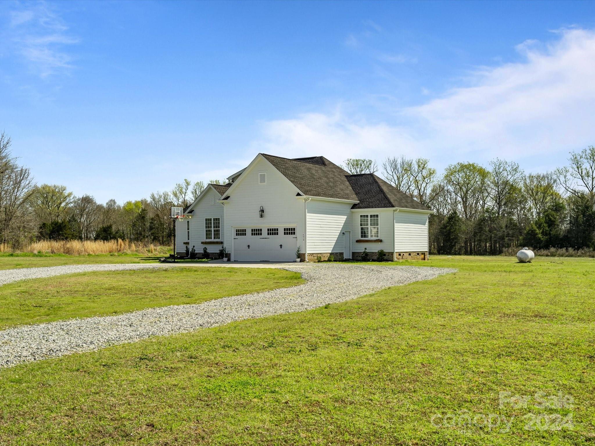 4078 Booney Road Rock Hill, SC 29730 - Photo 3 of 41 a front view of a house with a yard and lake view