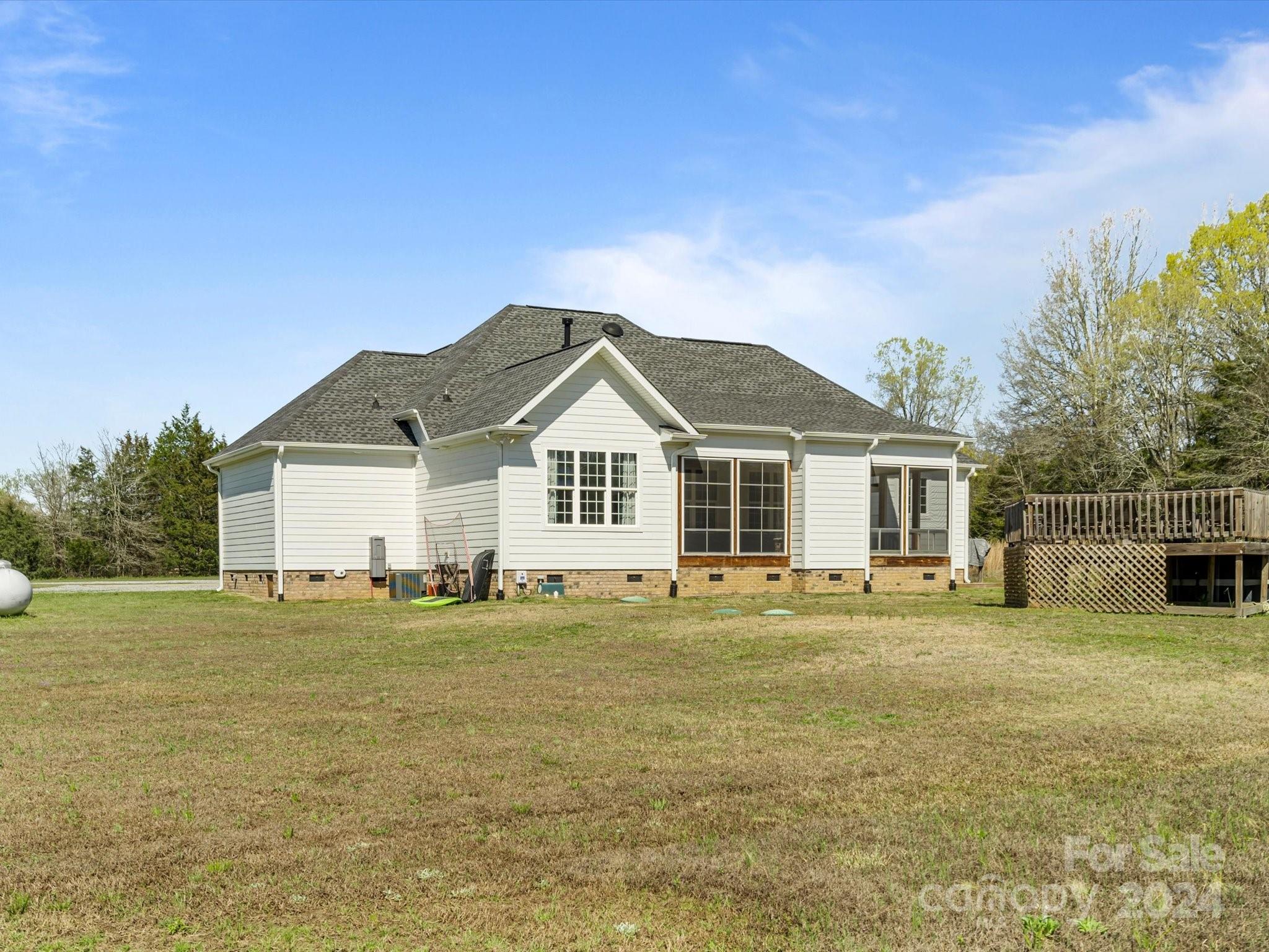 4078 Booney Road Rock Hill, SC 29730 - Photo 33 of 41 a view of a big house with a big yard and large trees
