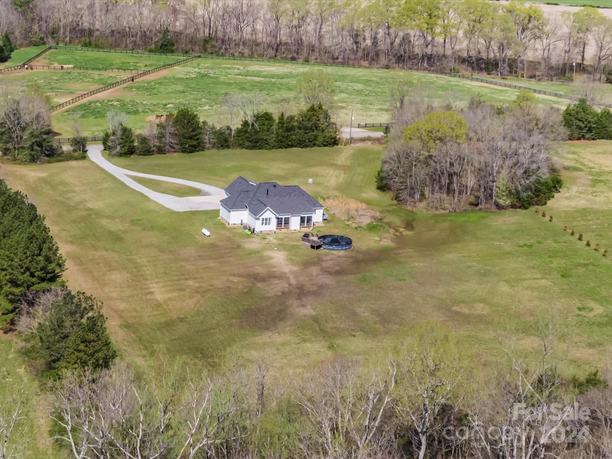 4078 Booney Road Rock Hill, SC 29730 - Photo 34 of 41 a view of a lake with a yard and large trees