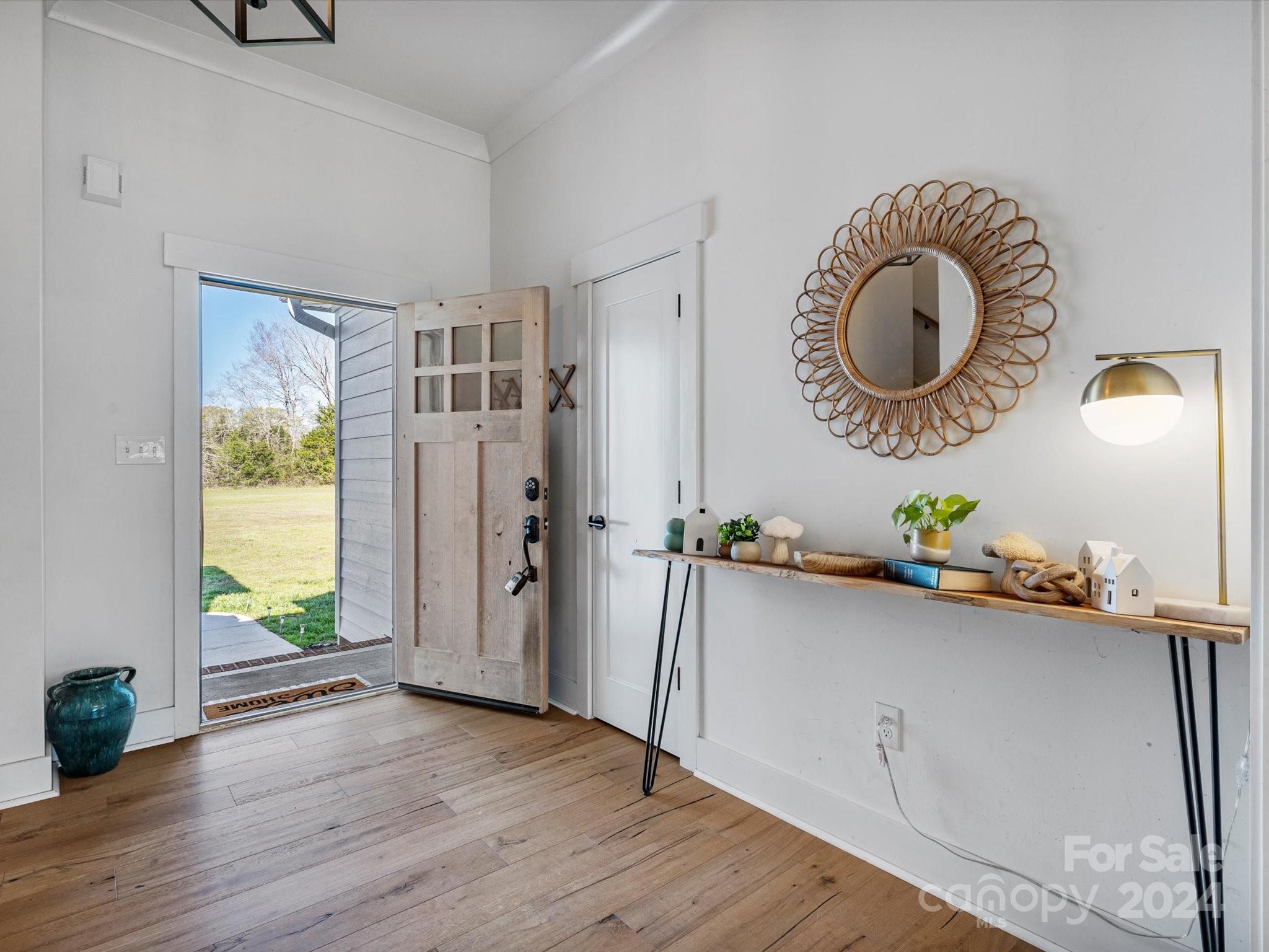 4078 Booney Road Rock Hill, SC 29730 - Photo 6 of 41 a hallway with a large mirror and a window