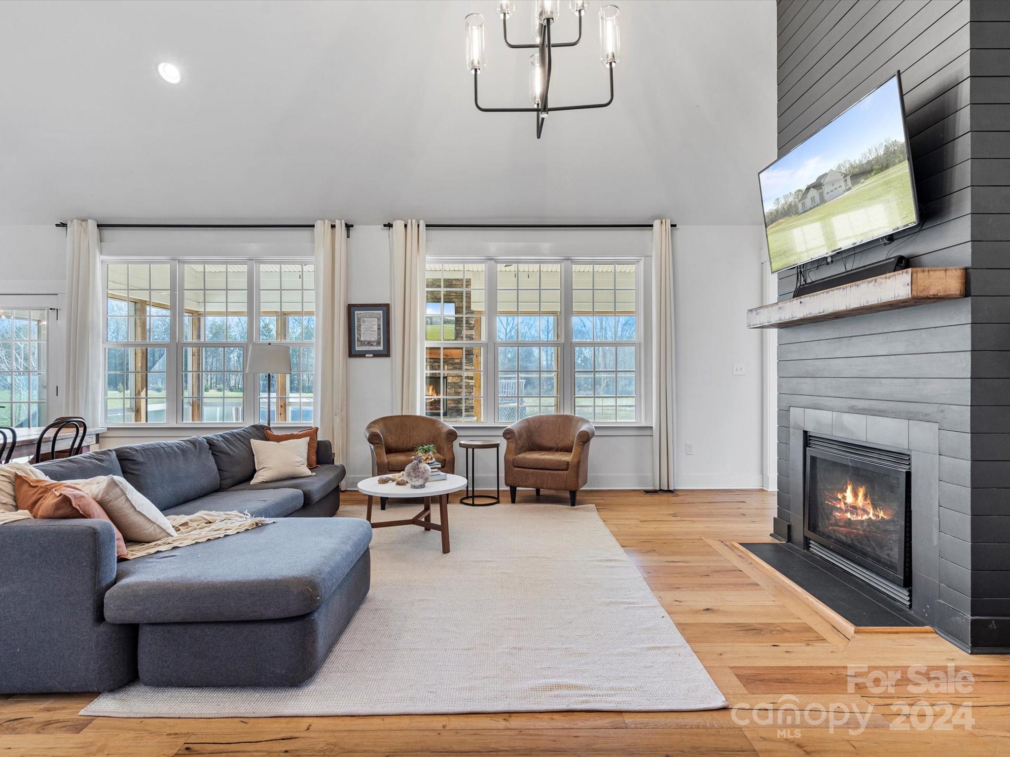 4078 Booney Road Rock Hill, SC 29730 - Photo 8 of 41 a living room with furniture large window and a fireplace