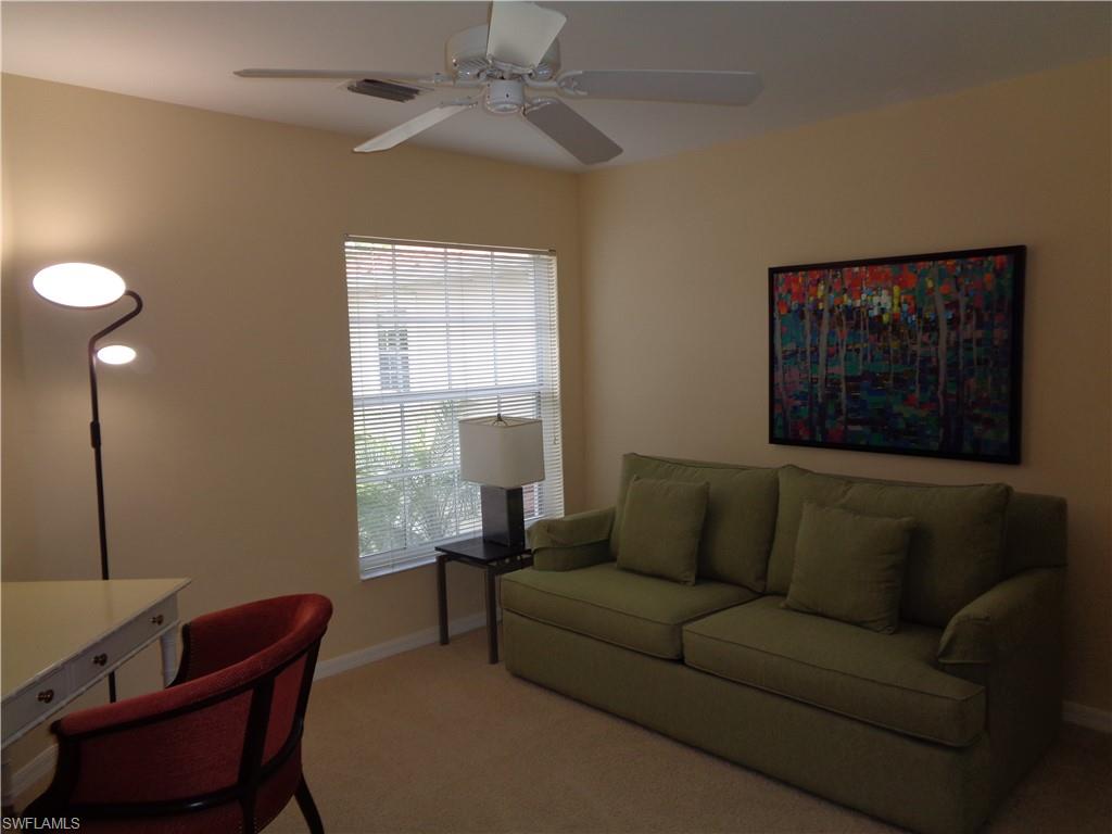 6115 Reserve Circle, Unit 2004 Naples, FL 34119 - Photo 2 of 10 a living room with furniture and a window