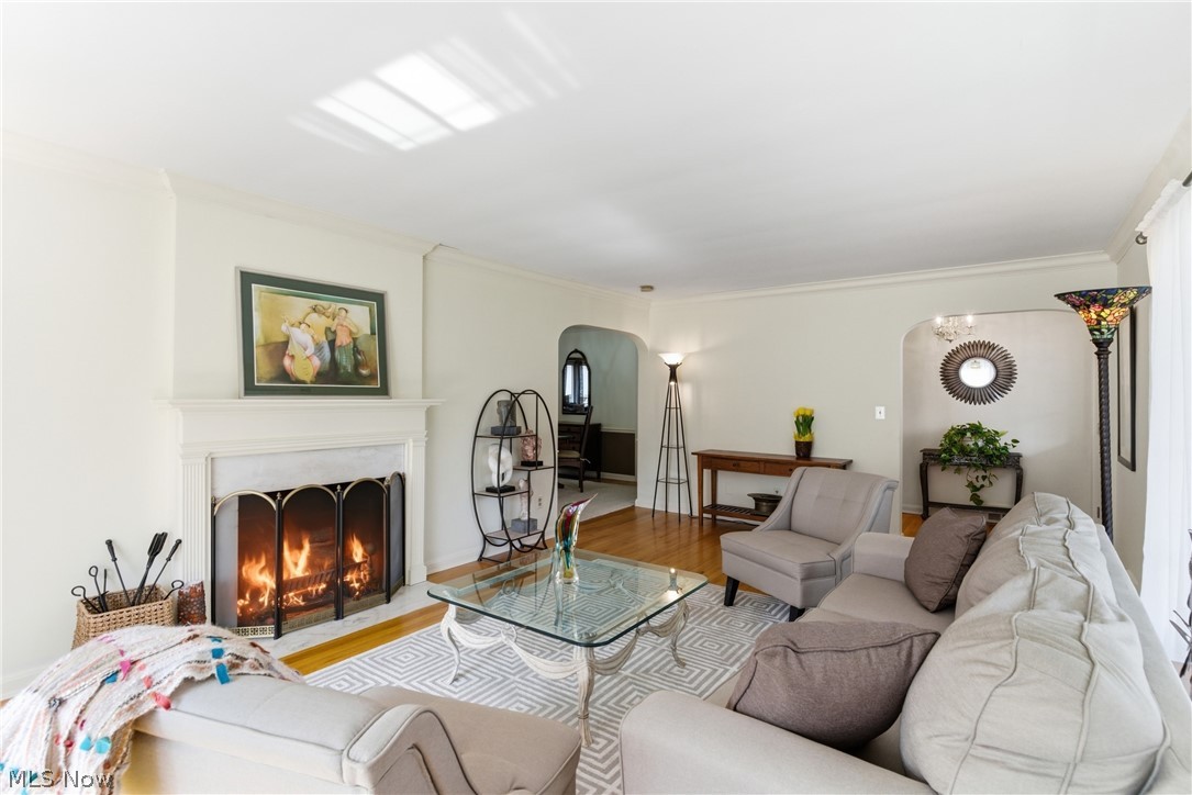 Wood burning fireplace and hardwood flooring, large picture window with loads of natural light