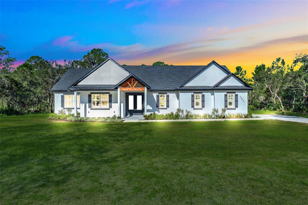 39831 Greenbrier Street Eustis, FL 32736 - Photo 1 of 1 a front view of a house with a garden