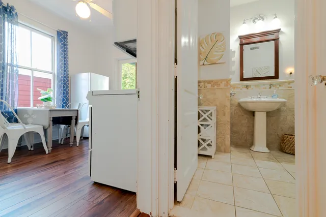 a bathroom with a sink a mirror and a window