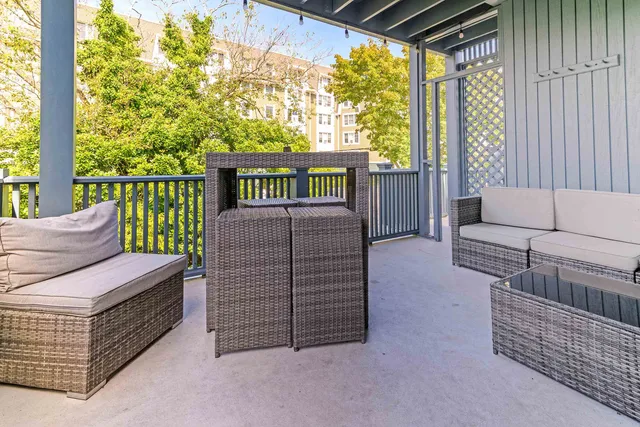 a bedroom with furniture and a gate