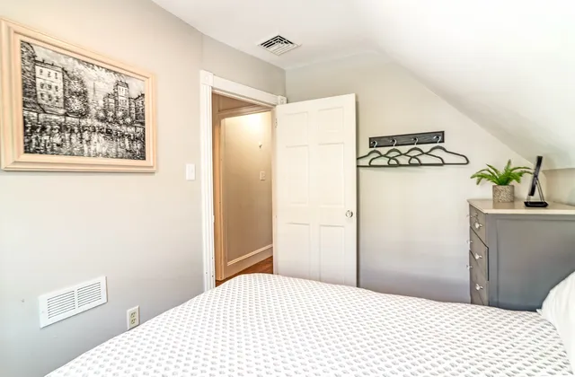 a bedroom with a bed and a table