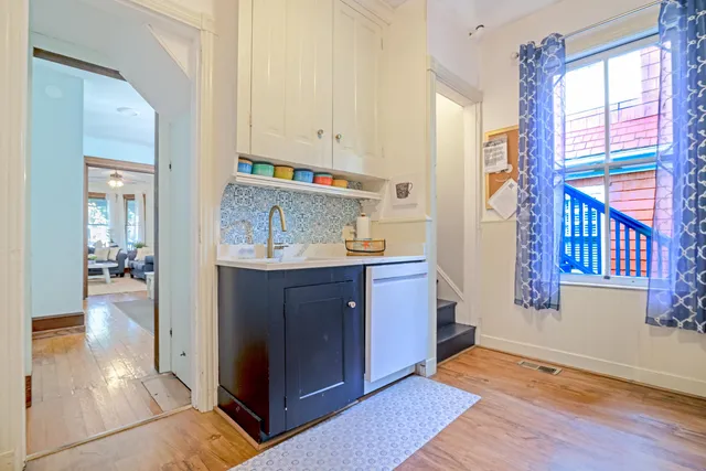 a kitchen with stainless steel appliances granite countertop a refrigerator and a stove