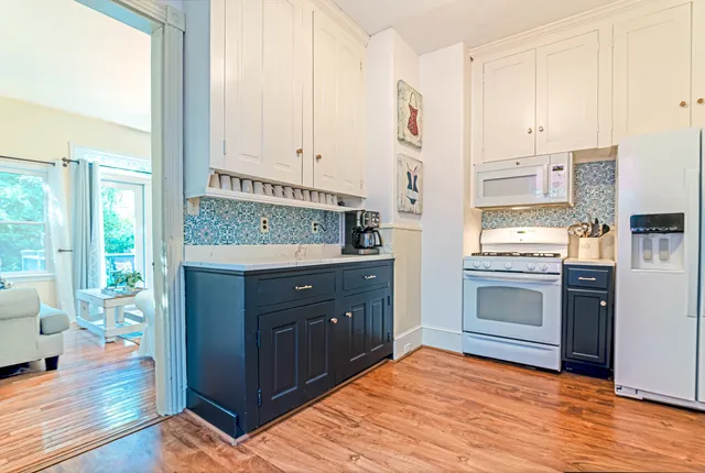 a kitchen with a sink and a stove top oven