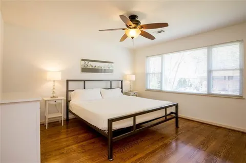 a bedroom with a bed and window