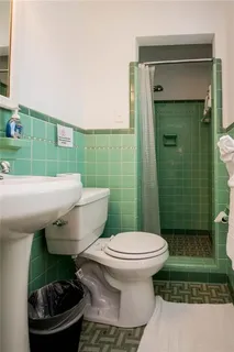 a bathroom with a toilet and a sink