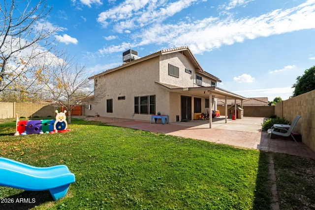 a view of a house with a yard porch and sitting area