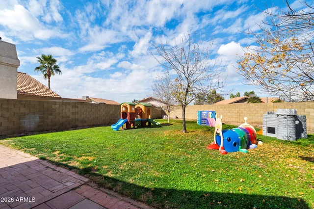 a childrens park with lots of swings and slides