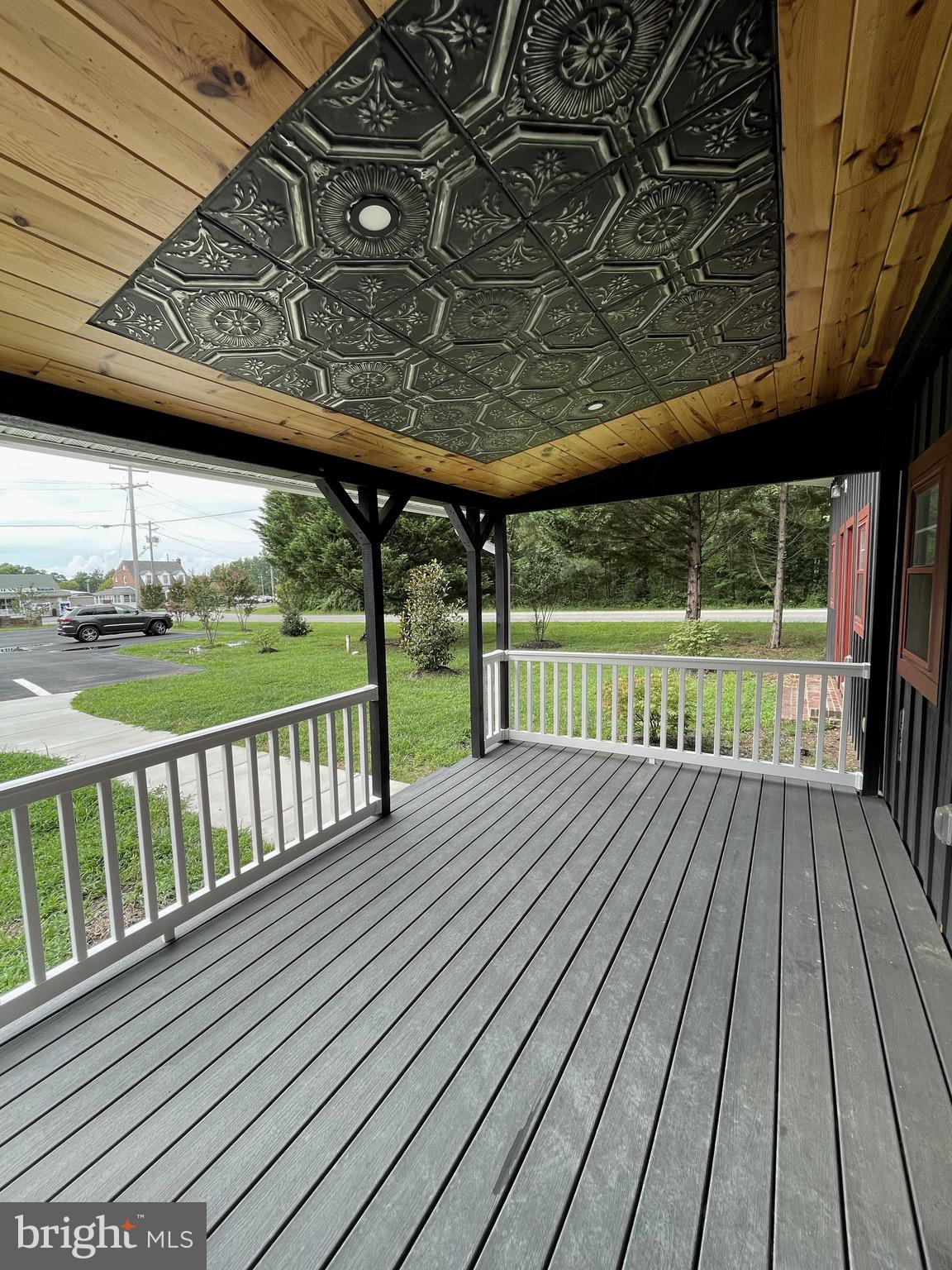 44600 Tall Timbers Road, Unit A Tall Timbers, MD 20690 - Photo 13 of 20 a view of porch with wooden floor