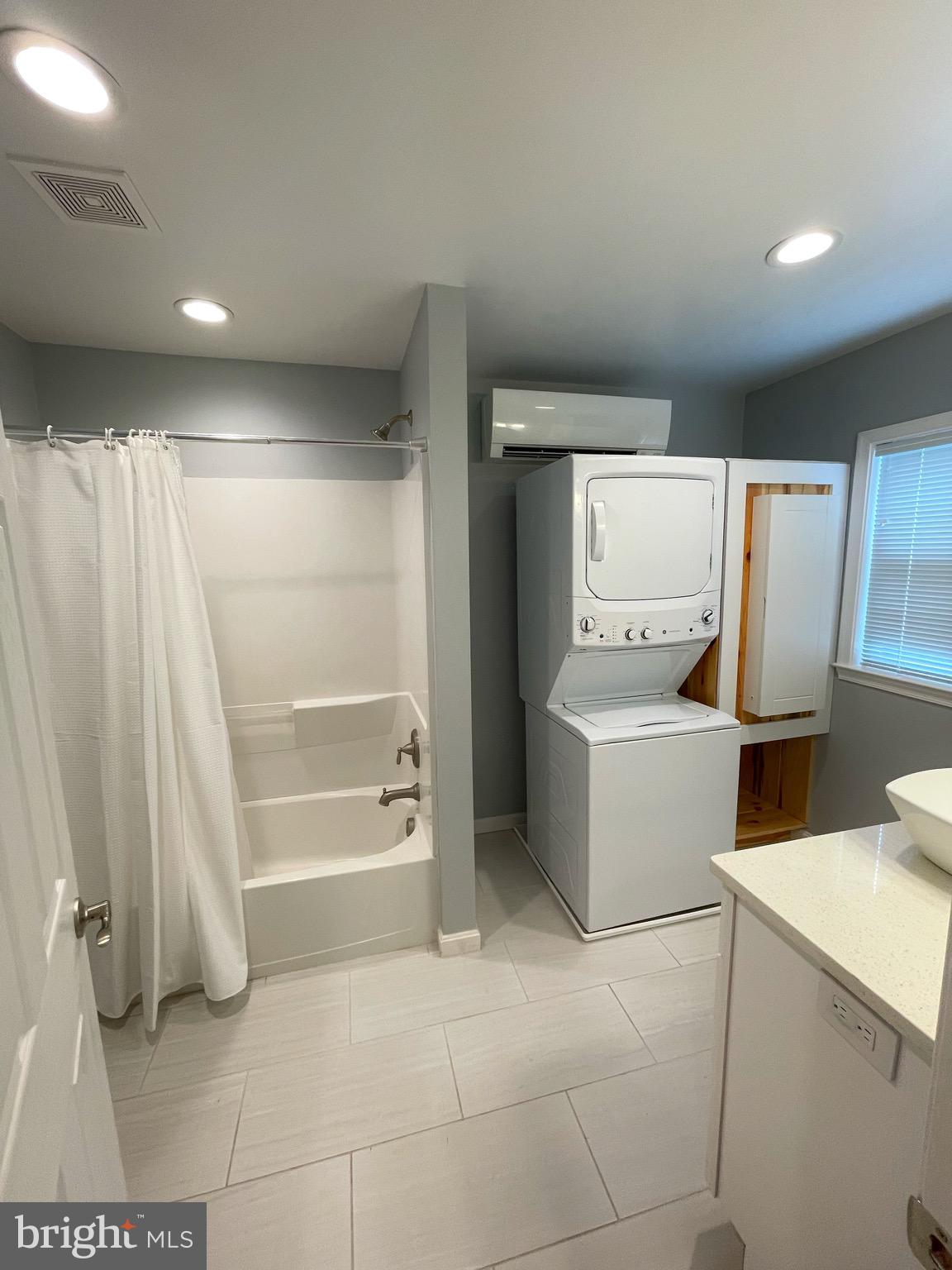 44600 Tall Timbers Road, Unit A Tall Timbers, MD 20690 - Photo 10 of 20 a bathroom with a sink toilet and shower