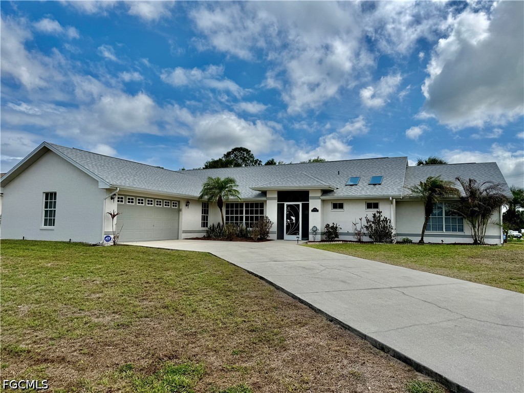 1400 Graham Circle Lehigh Acres, FL 33936 - Photo 1 of 47 a big house with swimming pool in front of it