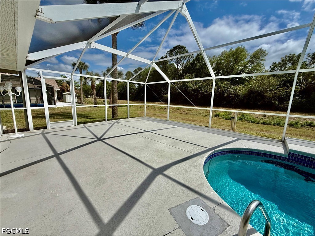 1400 Graham Circle Lehigh Acres, FL 33936 - Photo 12 of 47 a view of a backyard