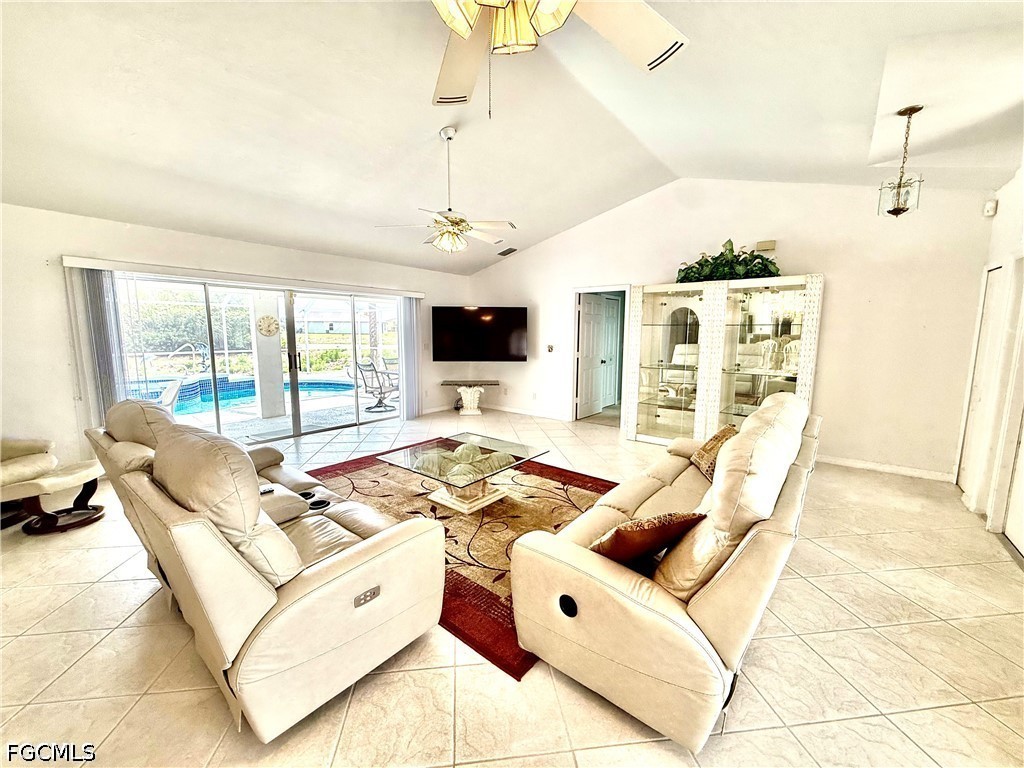 1400 Graham Circle Lehigh Acres, FL 33936 - Photo 15 of 47 a living room with furniture and a flat screen tv