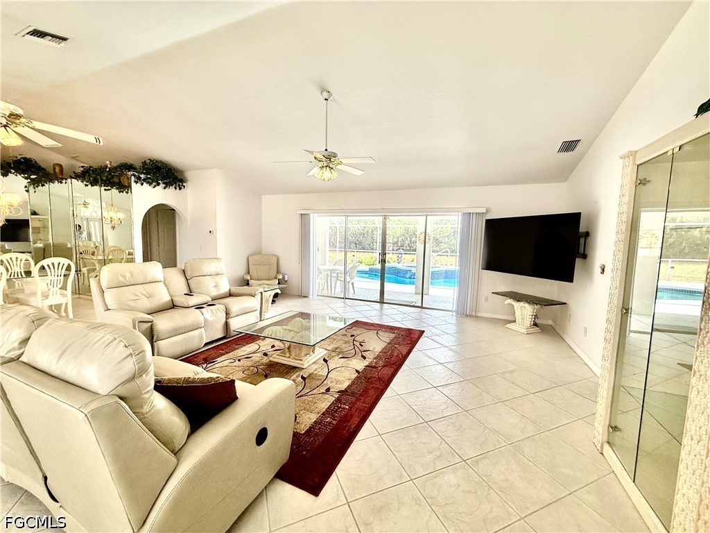 1400 Graham Circle Lehigh Acres, FL 33936 - Photo 17 of 47 a living room with furniture and a flat screen tv