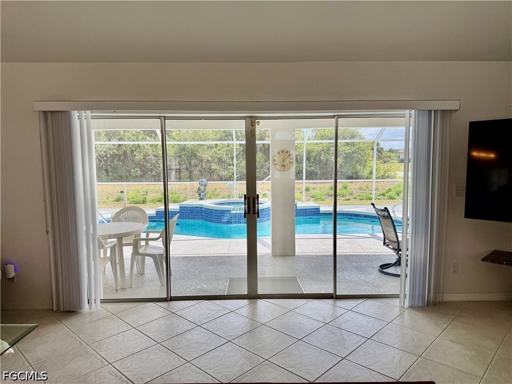 1400 Graham Circle Lehigh Acres, FL 33936 - Photo 19 of 47 a view of hallway with furniture and floor to ceiling window
