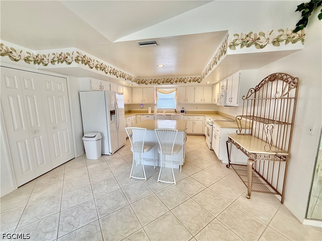 1400 Graham Circle Lehigh Acres, FL 33936 - Photo 24 of 47 a dining room with furniture and entryway