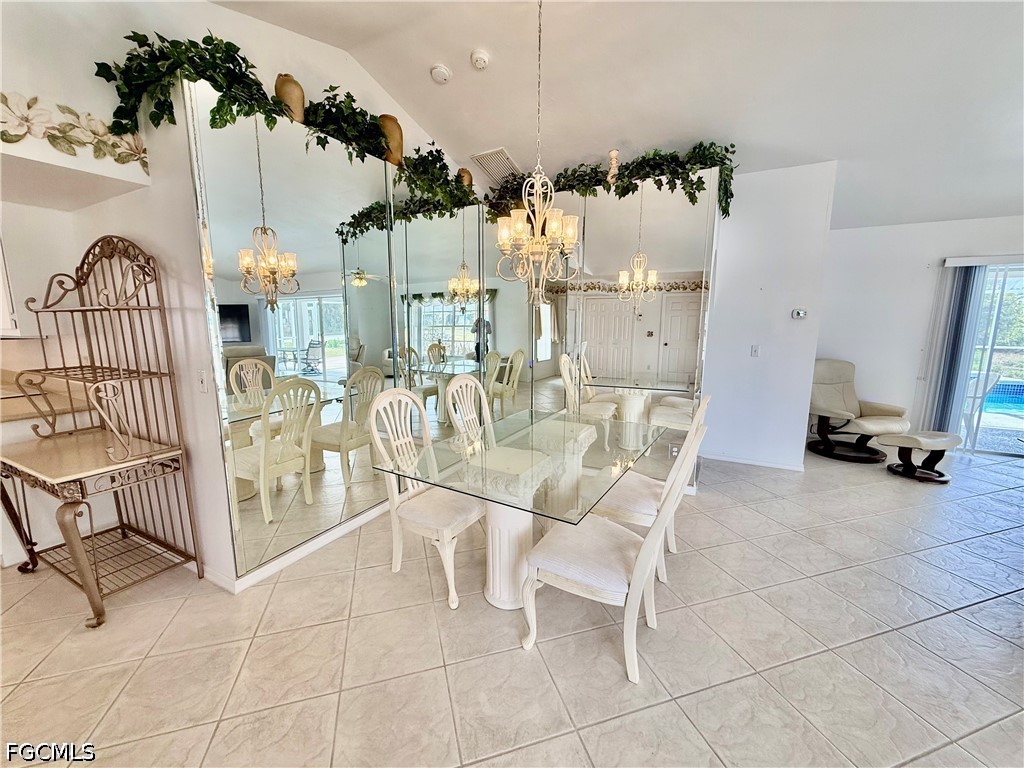 1400 Graham Circle Lehigh Acres, FL 33936 - Photo 26 of 47 a view of a livingroom with furniture and a floor to ceiling window