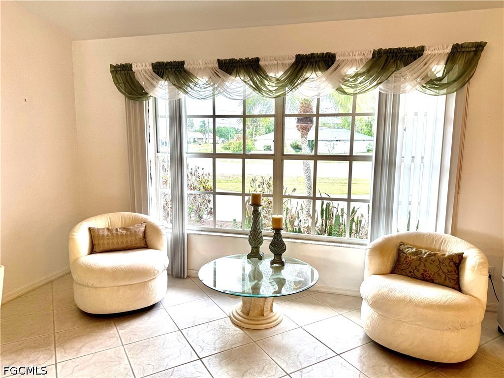 1400 Graham Circle Lehigh Acres, FL 33936 - Photo 28 of 47 a living room with furniture and a large window