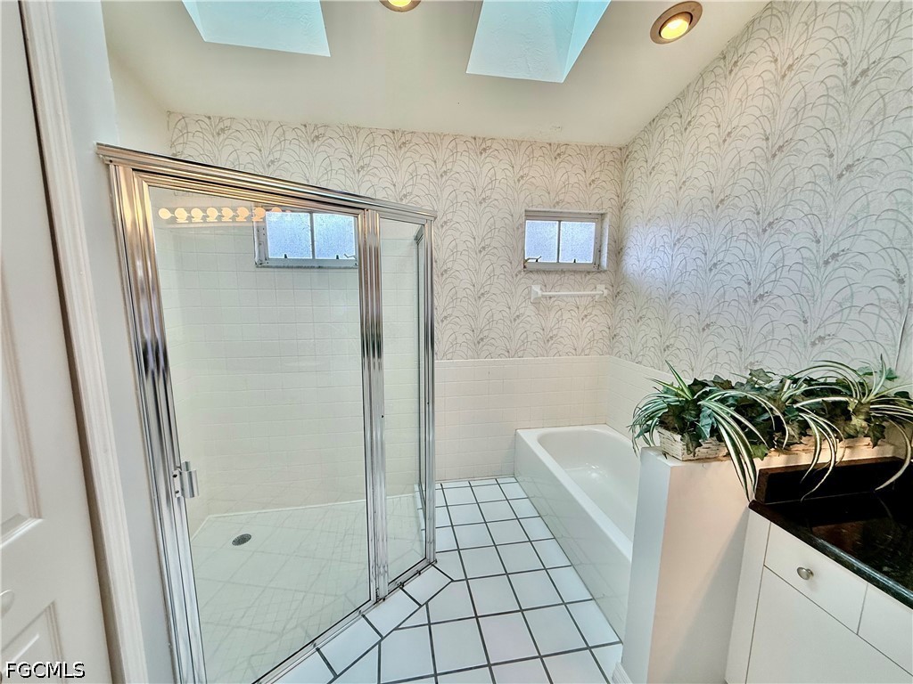 1400 Graham Circle Lehigh Acres, FL 33936 - Photo 36 of 47 a bath room with a sink and a shower