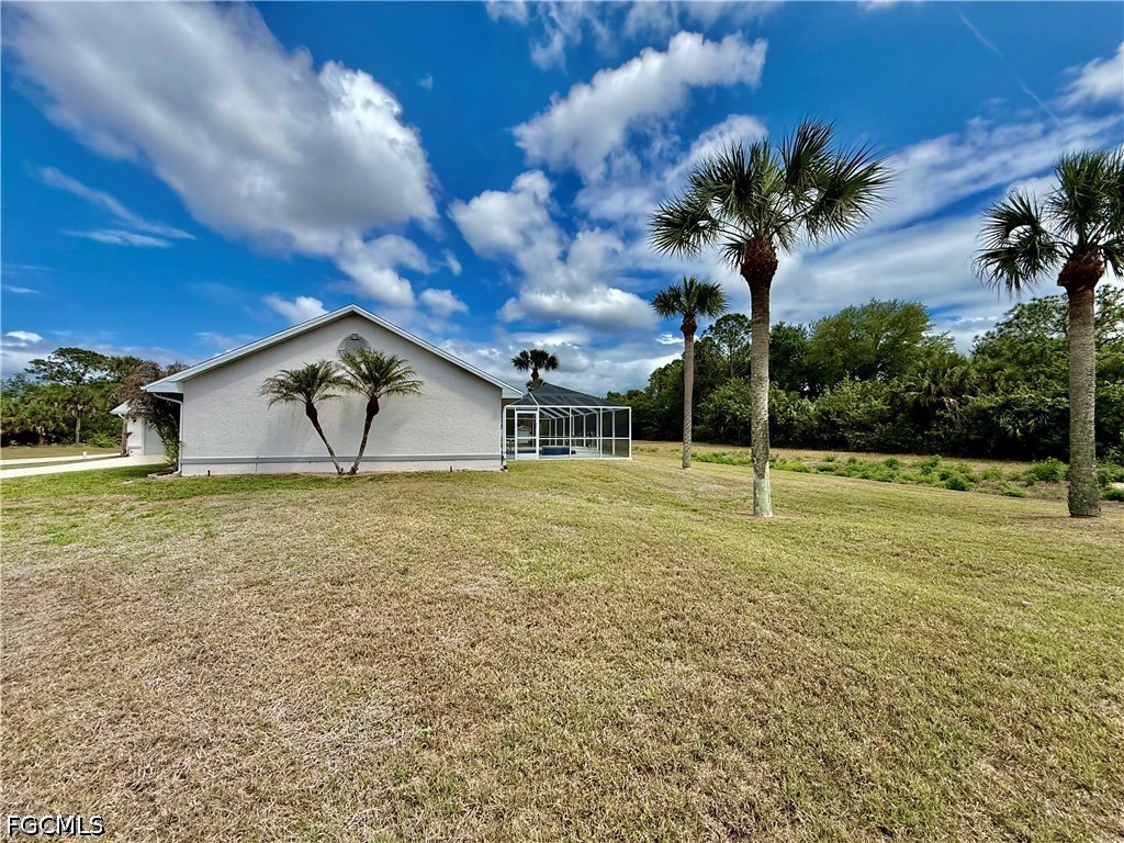 1400 Graham Circle Lehigh Acres, FL 33936 - Photo 43 of 47 a view of a garden