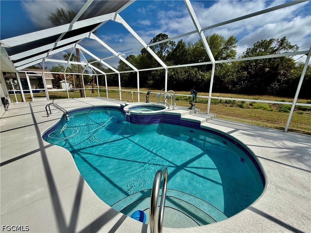 1400 Graham Circle Lehigh Acres, FL 33936 - Photo 6 of 47 a view of swimming pool with chairs