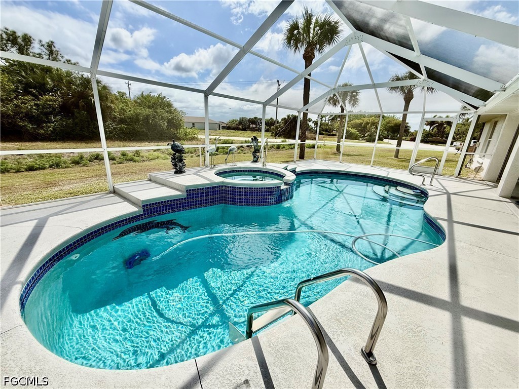 1400 Graham Circle Lehigh Acres, FL 33936 - Photo 7 of 47 a view of a swimming pool with a patio and yard