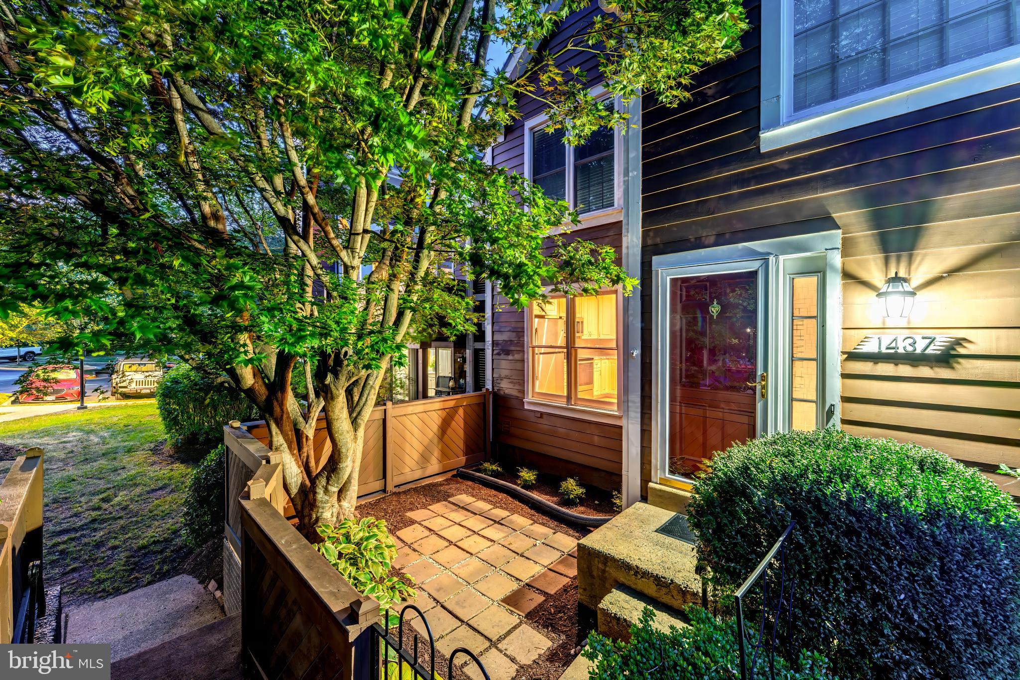 1437 Church Hill Place Reston, VA 20194 - Photo 1 of 6 a view of house with backyard outdoor seating and plants