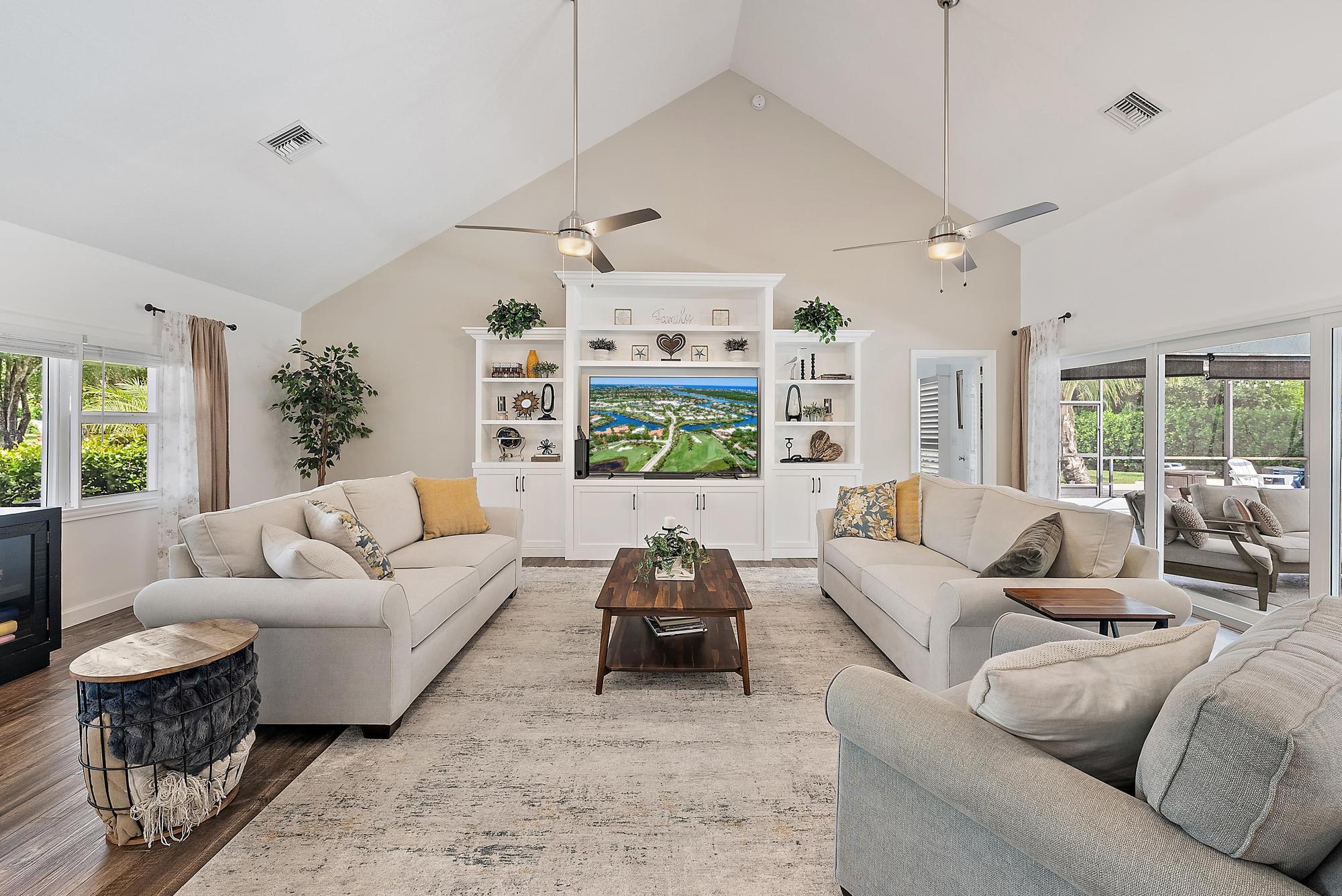 11 Loggerhead Lane Tequesta, FL 33469 - Photo 15 of 46 a living room with furniture and a large window
