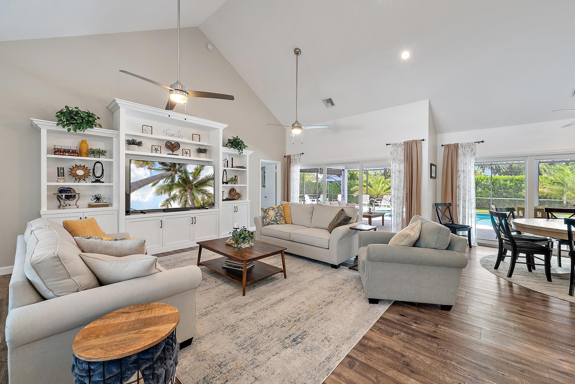11 Loggerhead Lane Tequesta, FL 33469 - Photo 16 of 46 a living room with furniture wooden floor and a large window