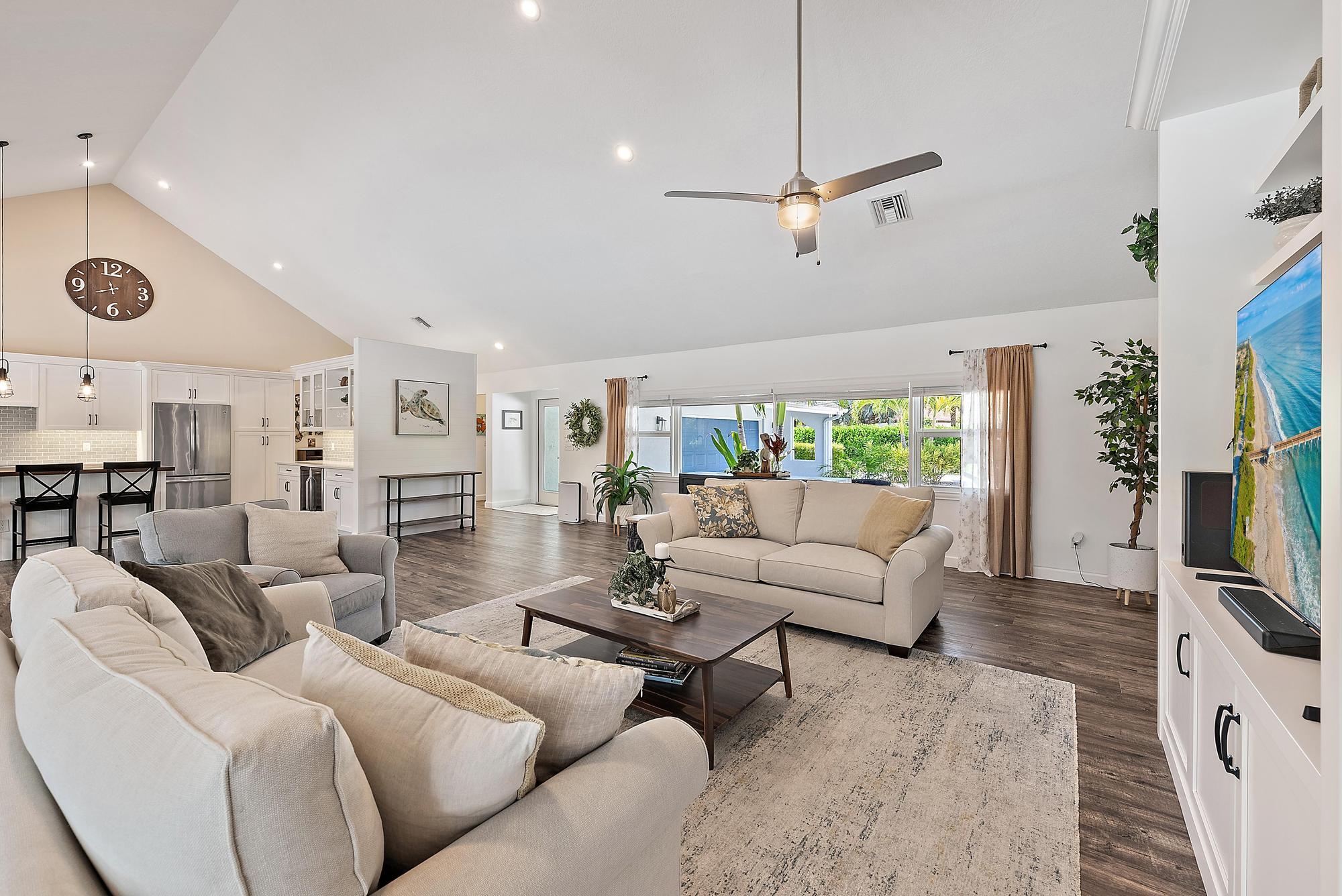 11 Loggerhead Lane Tequesta, FL 33469 - Photo 17 of 46 a living room with furniture and a flat screen tv