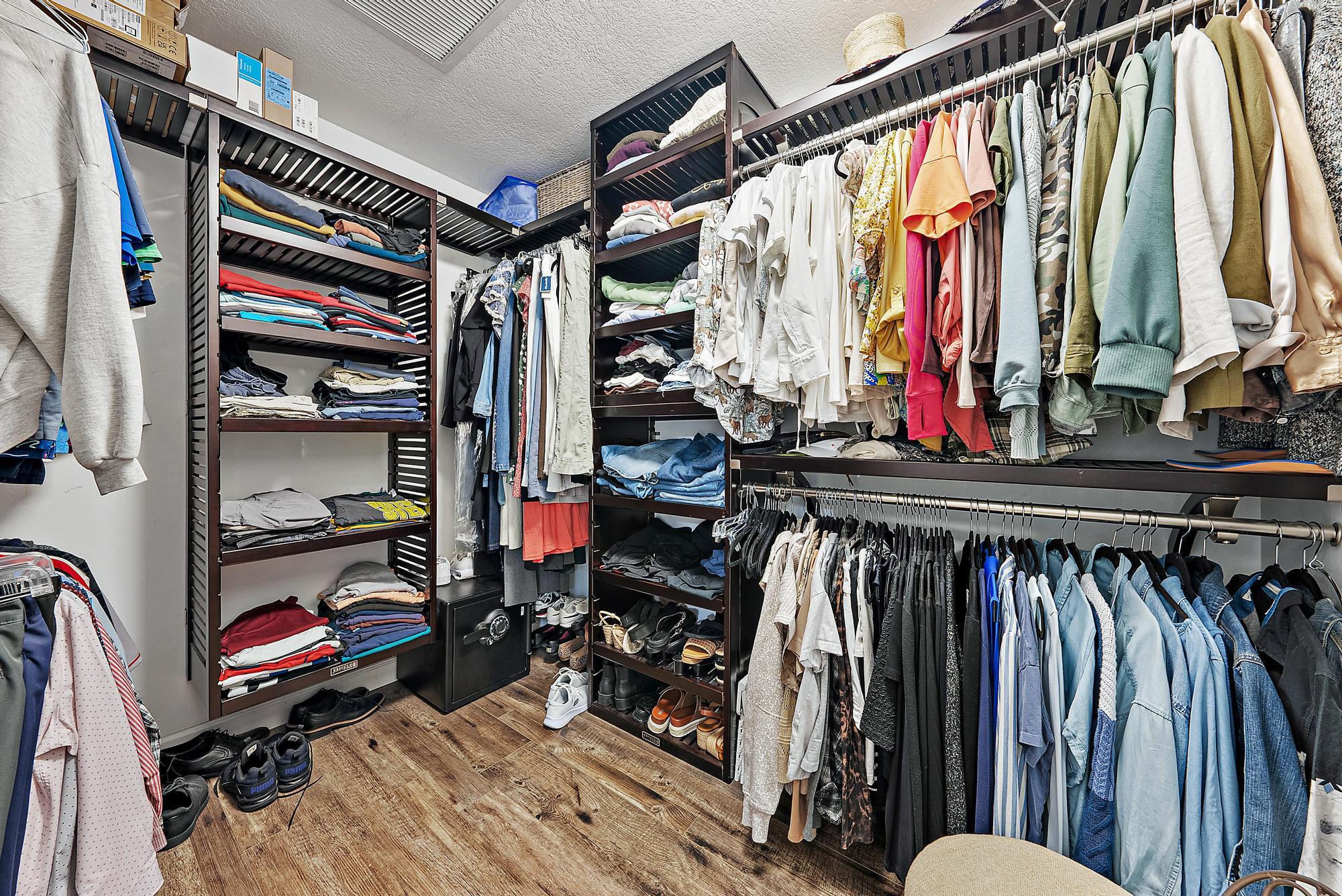 11 Loggerhead Lane Tequesta, FL 33469 - Photo 22 of 46 a view of walk in closet with clothes and shoes